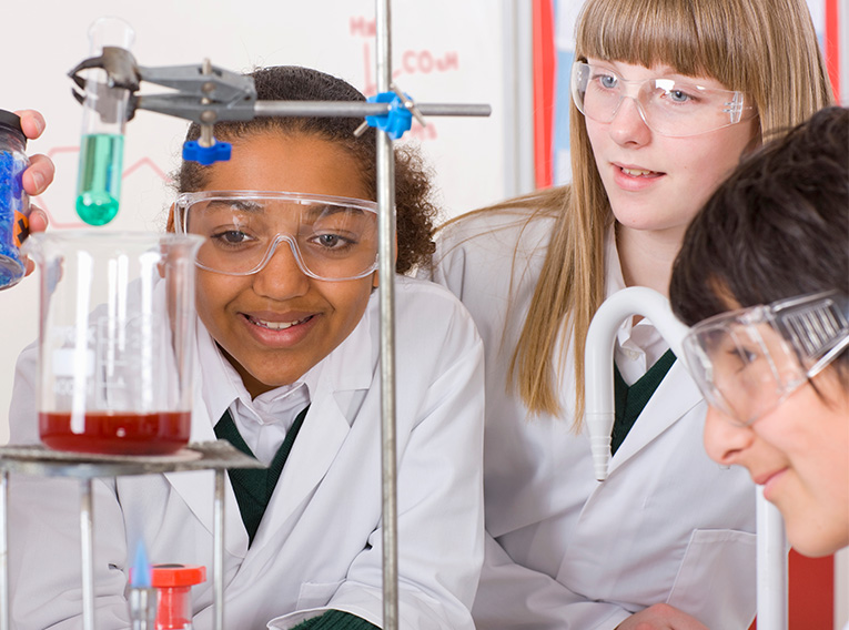 Young girls doing science experiments STEM education